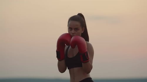 Woman Boxing Training Outdoors at Sunset