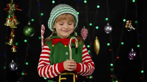 Happy Child Elf With Candy Cane