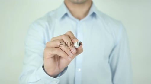 Man Writing Error on Clear Surface