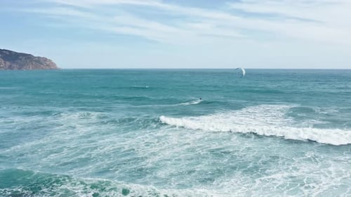 Kiteboarder Riding Big Waves in Atlantic Ocean