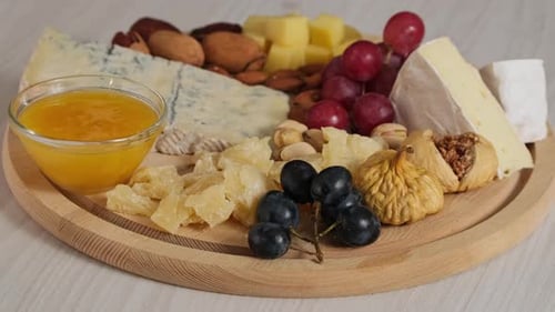 Cheese Board with Assorted Fruits and Nuts
