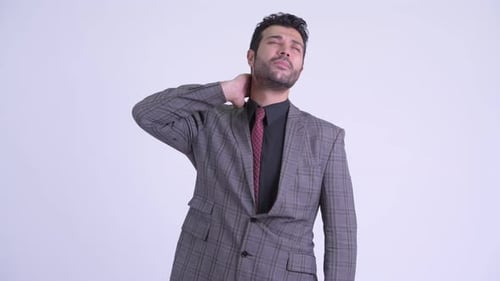 Man in Suit Massaging Stiff Neck