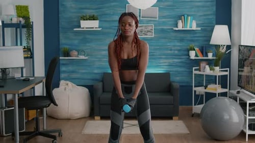 Woman Doing Dumbbell Squats in Living Room