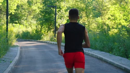 Slow Motion Man Running on Circular Road