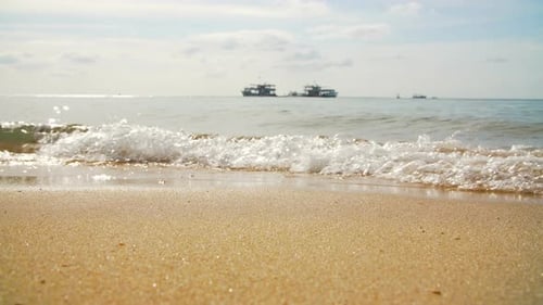 Tropical Sand Beach with a Boat on Horizon