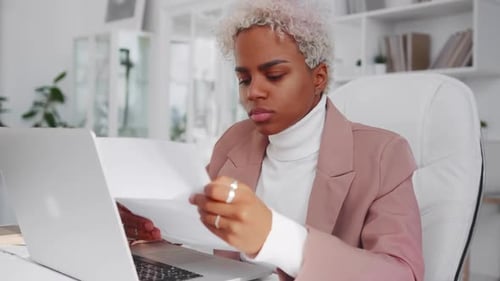 Woman Working at Her Desk in Modern Office