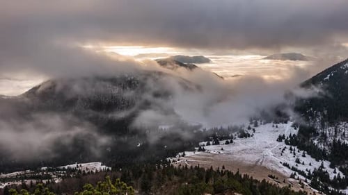 Mountain Range at Sunset Obscured by Clouds