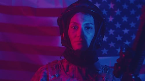 Soldier Saluting with Rifle in Front of US Flag