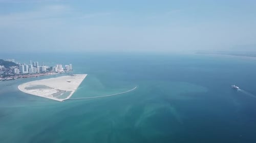 Aerial view a cruise ship is move at Penang sea near reclamation island