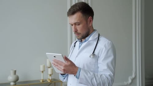 Doctor Using Tablet for Healthcare in Office