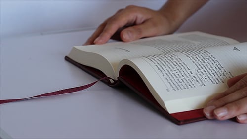 Elegant Book Opens and Closes on White Table