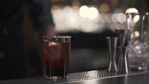 Glass with Sparkling Cold Alcohol Cocktail or Whiskey with Cube Ice for Refreshing Made in Bar