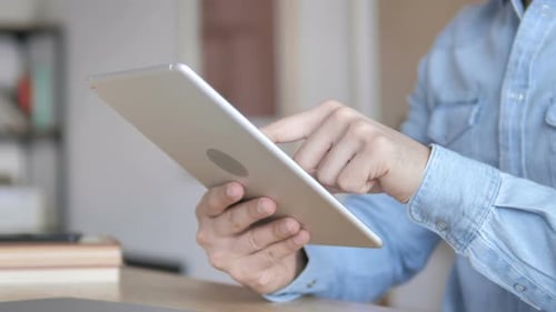 Hands Operating Tablet Device in Home or Office