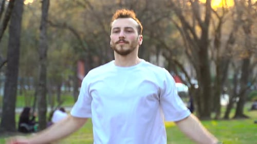 Man doing sports by jumping in the park.
