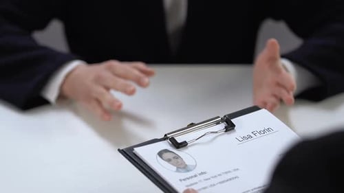 Male Recruiter Approving Job Applicant, Making Note in Resume, Employment Agency