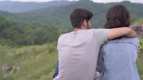 Happy with couple leisure and hug at camping with feeling romantic in the mountain.