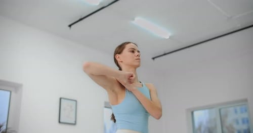 Dancer Warms Up Before Rehearsal in the White Bright Dance Hall, Ballet Rehearsal, Ballerina in the