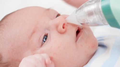 Infant Receives Nasal Aspiration for Congestion Relief