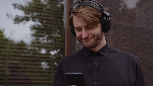 Young Adult Using Smartphone in Urban Setting