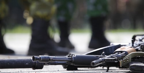 Soldiers Standing with Rifles in Military Formation