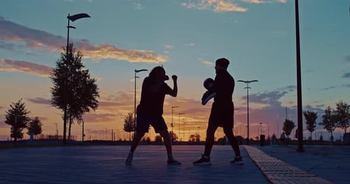 Street Workout of Fight Club African Fighter Training with Coach in Evening in Sunset Prores