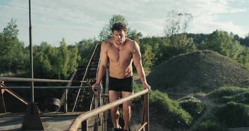 Muscular Man Doing Core Exercises Outdoors