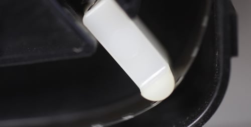 Close Up of White Plastic Machine Component