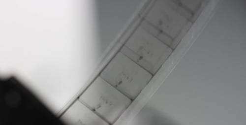 Film Reel Rolling Through Machine