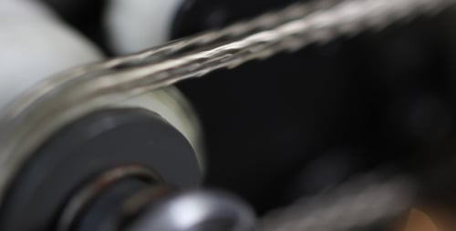 Chain Turning on Machine, Close Up