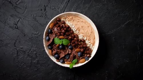 Delicious Breakfast Bowl with Chocolate Crisps and Blueberries