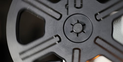 Film Reel Rotating in Close-Up