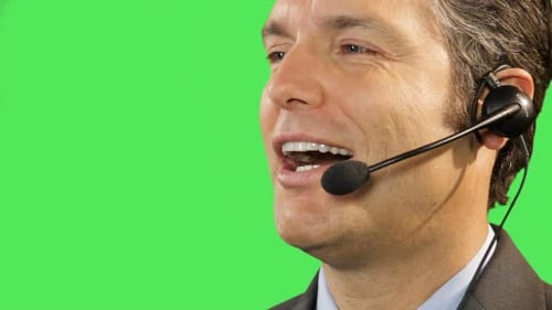 Man Talking on Headset against Green Screen