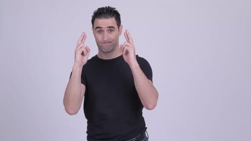 Man Crossing Fingers and Wishing