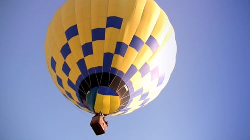 Hot Air Balloon Soars in a Blue Sky