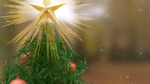 Festive Christmas Tree with Glowing Golden Star and Glitter Particles