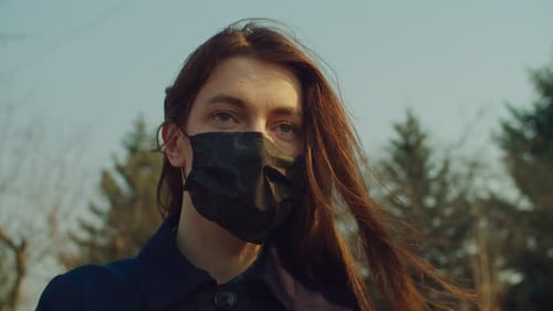 Woman Wearing Face Mask Outdoors During the Day