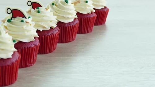 Holiday Cupcakes with White Frosting and Festive Decoration