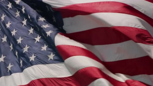 Close up shot of American Flag waving in wind