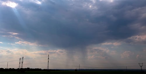 Dramatic Storm Clouds Over Rural Landscape