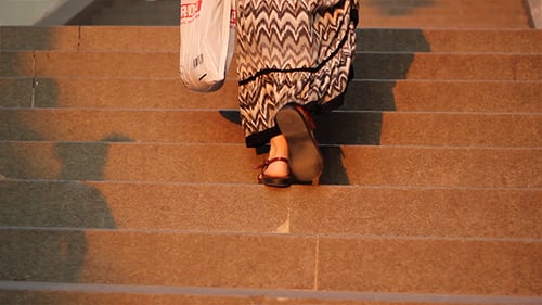 People Walking Up Stairs During Golden Hour