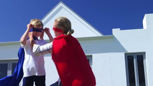 Family Fun: Child and Adult in Superhero Costumes