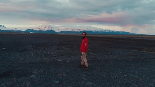 Man on rocky ground in mountains