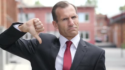 Thumbs Down By Businessman