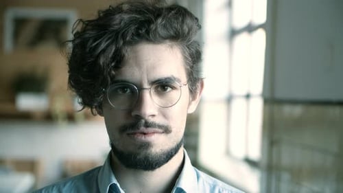 Closeup Shot of Smiling Young Man in Eyeglasses