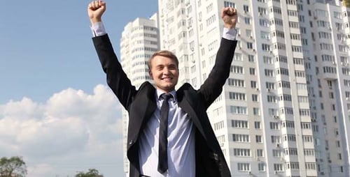 Man Celebrates Success in the City