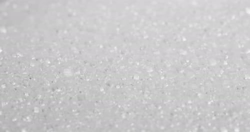 Stack of white sugar in rotation