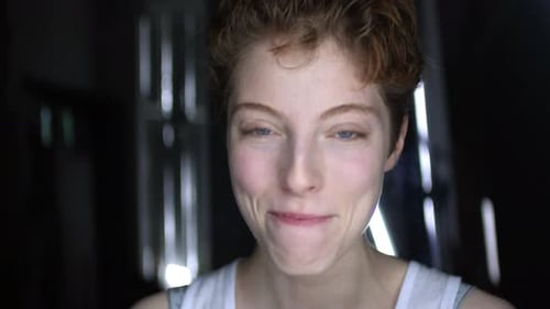 Portrait of Cheerful Woman on Dark Background