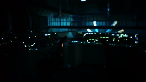 Futuristic Control Room Panels with Glowing Green Lights and Data