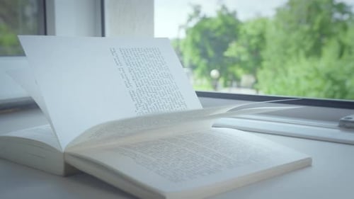 Open Book on Sill with Tree Background