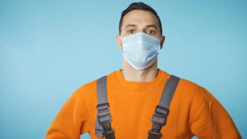 Man Wearing Face Mask and Work Overalls